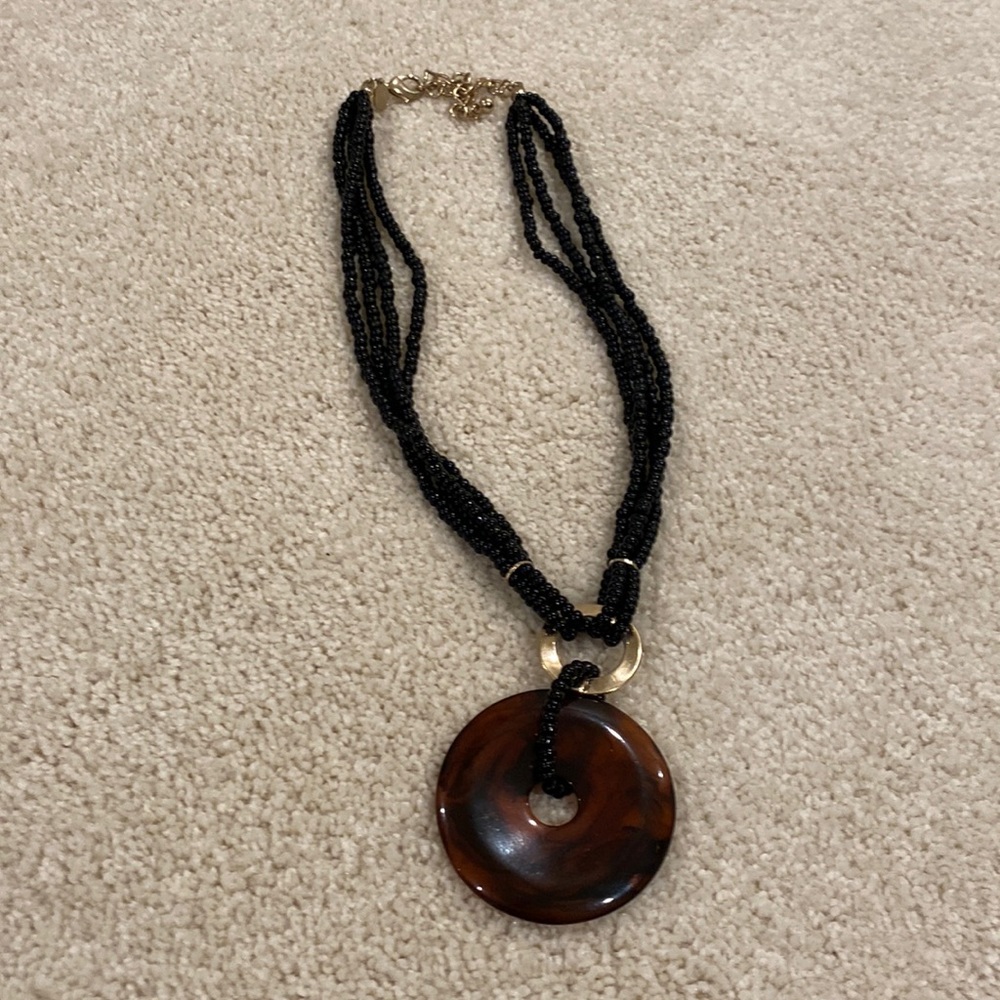 Black bead and tortoise medallion necklace